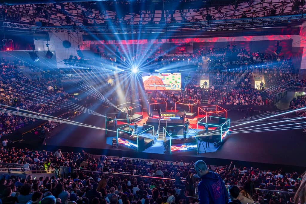 Toto Hall Holon from the stands: light beams over the stage and lit player booths